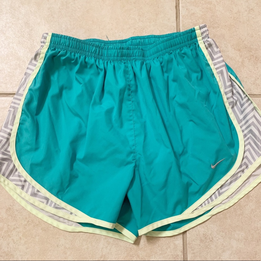Teal and yellow nike dri-fit running shorts